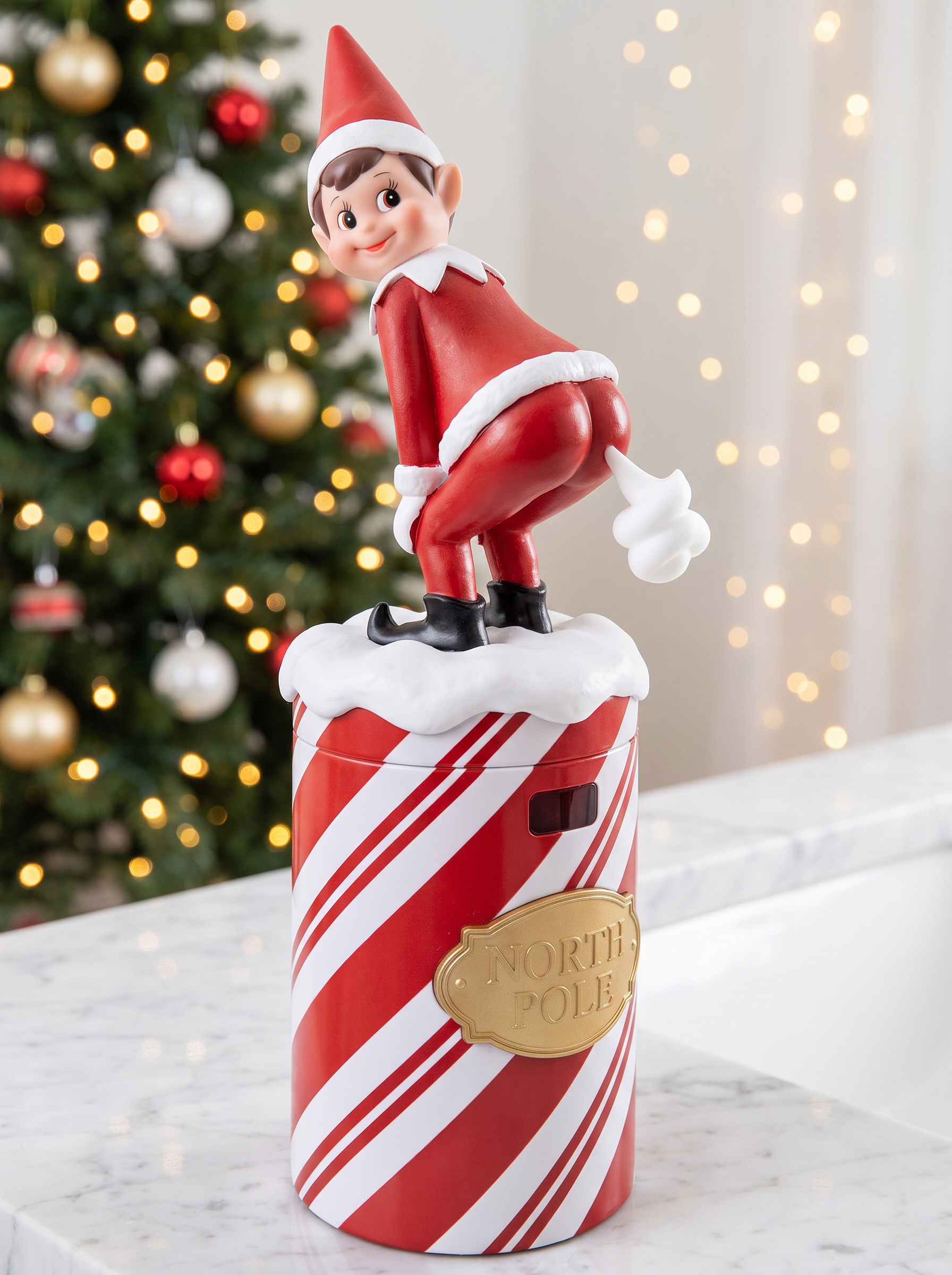 Cheeky Elf Soap Dispenser front view with candy-cane body and elf on top